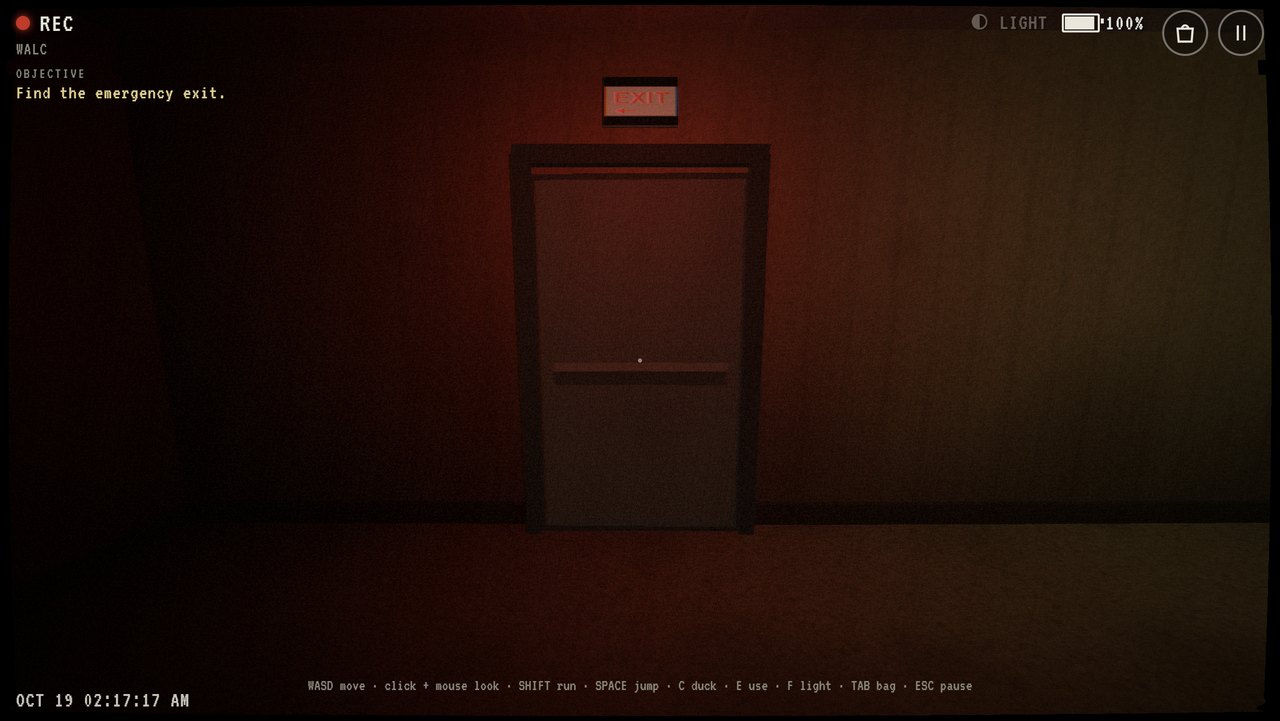 A red-lit emergency exit door at the end of a hallway.