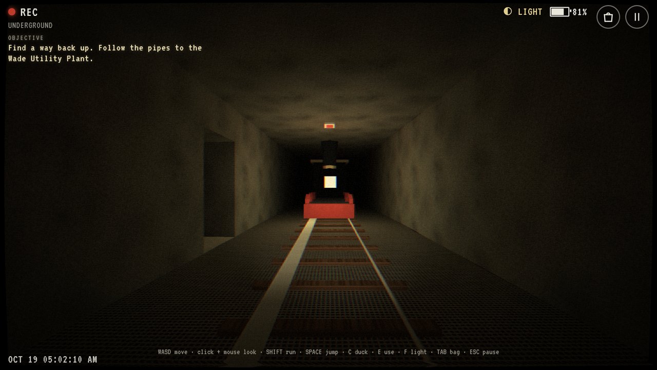 A red ghost locomotive with a blinding headlamp coming down a tunnel.