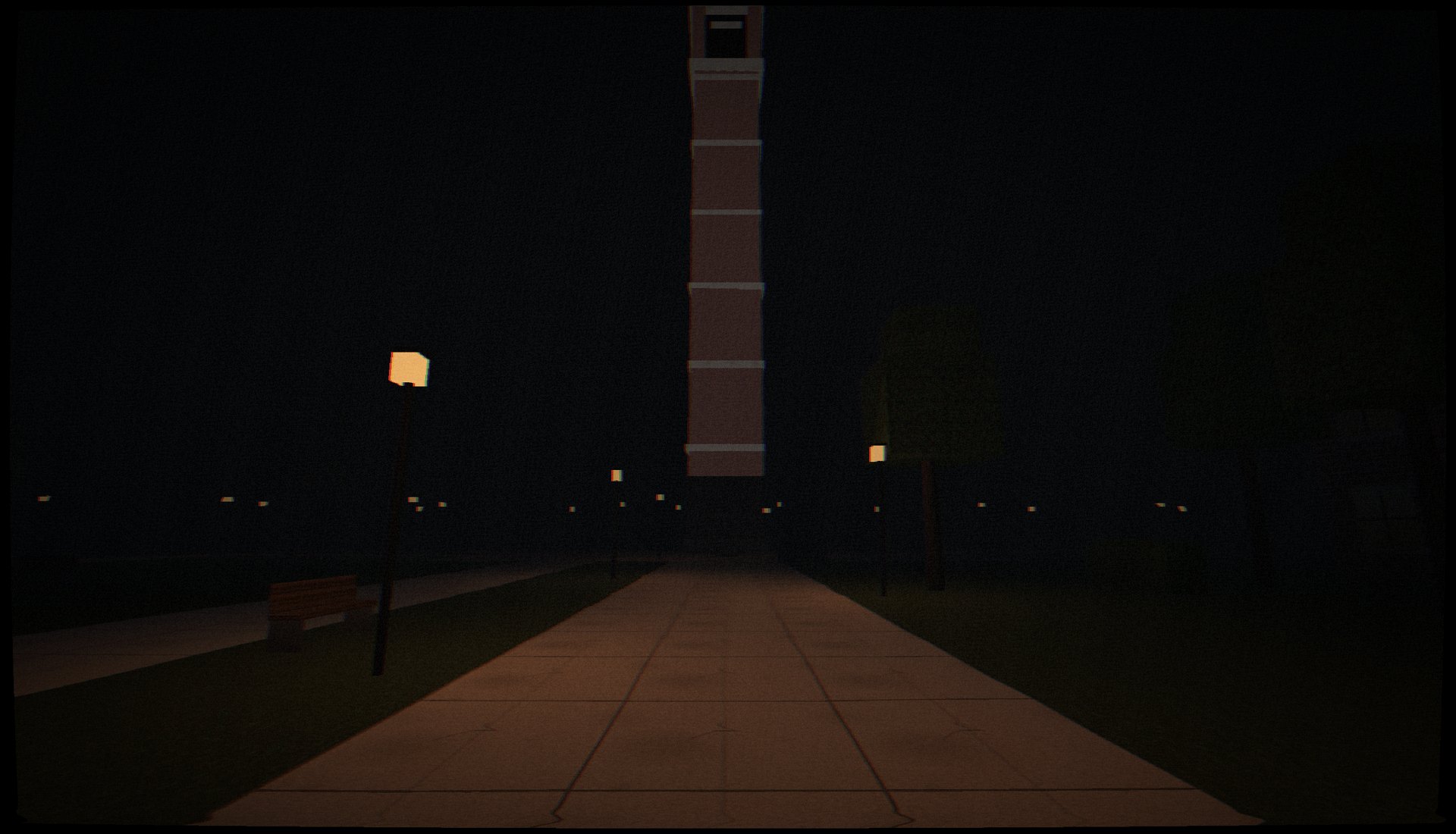 The Bell Tower rising out of the dark at the end of a lamp-lit path.